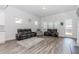 Spacious living area with neutral walls and floors, flooded with natural light at 3397 Long Creek Drive, Buford, GA 30519