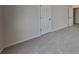 A neutral bedroom with carpet and two doors at 4688 Snap Creek Ln, Decatur, GA 30035