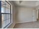 This bedroom has a large window and a neutral carpet at 4688 Snap Creek Ln, Decatur, GA 30035