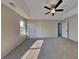 Spacious main bedroom featuring neutral carpet, a ceiling fan, and an abundance of natural light at 4688 Snap Creek Ln, Decatur, GA 30035