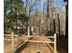 Backyard featuring a wood fence and natural landscape, creating a peaceful outdoor space at 7592 Watson Kaye, Stone Mountain, GA 30087