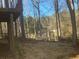 View of the backyard with a fence and wooded boundary at 7592 Watson Kaye, Stone Mountain, GA 30087