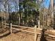 Backyard featuring a wood fence and natural landscape, creating a peaceful outdoor space at 7592 Watson Kaye, Stone Mountain, GA 30087