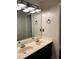 Bathroom featuring a double sink vanity with modern lighting at 7592 Watson Kaye, Stone Mountain, GA 30087