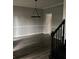 Dining room with modern wood flooring, neutral color palette and a decorative light fixture at 7592 Watson Kaye, Stone Mountain, GA 30087
