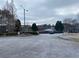 Community entrance and gate with mature trees at 7592 Watson Kaye, Stone Mountain, GA 30087
