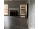 Living room featuring wood flooring, fireplace, and bright windows at 7592 Watson Kaye, Stone Mountain, GA 30087