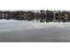 Scenic water view showcasing the reflection of the houses across the lake or large pond at 7592 Watson Kaye, Stone Mountain, GA 30087