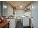 Basement area with washer, dryer, and utility sink, offering practicality and functionality for household tasks at 2640 Spring Se Dr, Smyrna, GA 30080