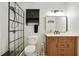 Modern bathroom featuring a tiled shower, a vanity with storage, and sleek fixtures at 2640 Spring Se Dr, Smyrna, GA 30080