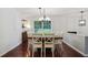 Bright dining room with hardwood floors, a wooden table, and large windows for natural light at 2640 Spring Se Dr, Smyrna, GA 30080