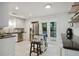 Kitchen boasting stainless appliances, sleek white cabinets, and French doors to a outdoor deck at 2640 Spring Se Dr, Smyrna, GA 30080