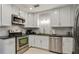 Well-equipped kitchen featuring stainless steel appliances, sleek countertops, and ample cabinet space at 2640 Spring Se Dr, Smyrna, GA 30080