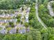 Aerial view of homes nestled within a green wooded neighborhood at 4188 Cookcreek Place Northwest Nw Pl, Lilburn, GA 30047
