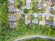 Aerial view of a quiet residential neighborhood surrounded by lush trees at 4188 Cookcreek Place Northwest Nw Pl, Lilburn, GA 30047