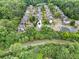 Aerial view of homes in a quiet neighborhood surrounded by trees at 4188 Cookcreek Place Northwest Nw Pl, Lilburn, GA 30047