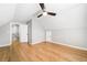 Spacious bedroom with wood floors, a ceiling fan, and natural light from a window at 4188 Cookcreek Place Northwest Nw Pl, Lilburn, GA 30047