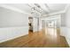Elegant dining room with hardwood floors and wainscoting detail at 4188 Cookcreek Place Northwest Nw Pl, Lilburn, GA 30047