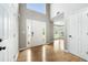 Elegant foyer featuring gleaming hardwood floors and a soaring two-story entrance at 4188 Cookcreek Place Northwest Nw Pl, Lilburn, GA 30047