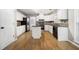 Well-appointed kitchen with a center island and ample cabinet space at 4188 Cookcreek Place Northwest Nw Pl, Lilburn, GA 30047