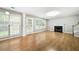 Inviting living room with a cozy fireplace and lots of natural light at 4188 Cookcreek Place Northwest Nw Pl, Lilburn, GA 30047