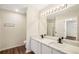 Bright bathroom featuring double vanity with white countertops and modern fixtures at 4593 Parkway Cir, Atlanta, GA 30349