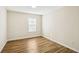 Bedroom featuring a window and wood floors at 4593 Parkway Cir, Atlanta, GA 30349