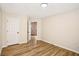 Bedroom featuring a doorway, window, and wood floors at 4593 Parkway Cir, Atlanta, GA 30349