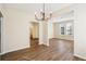The living room features an open layout with wood floors, neutral walls, and a modern chandelier at 4593 Parkway Cir, Atlanta, GA 30349