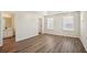 The main bedroom features wood floors, neutral walls, and an en-suite bathroom at 4593 Parkway Cir, Atlanta, GA 30349