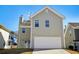 View of the rear of the home with a two car garage at 4593 Parkway Cir, Atlanta, GA 30349