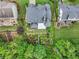 Birds eye view of a landscaped backyard featuring mature trees and garden at 7060 Summit Ridge Chase, Cumming, GA 30041