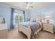 Cozy bedroom with ample natural light, light blue walls, and well-coordinated furnishings at 7060 Summit Ridge Chase, Cumming, GA 30041