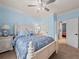 Inviting bedroom with light blue walls, natural light, and coordinating furnishings at 7060 Summit Ridge Chase, Cumming, GA 30041
