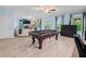 Spacious game room with pool table, fireplace and access to the backyard at 7060 Summit Ridge Chase, Cumming, GA 30041