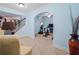 This home features a dedicated home gym with workout equipment and easy access to the staircase at 7060 Summit Ridge Chase, Cumming, GA 30041
