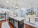 Spacious kitchen with wine fridge, stainless steel appliances, and an island with seating at 7060 Summit Ridge Chase, Cumming, GA 30041