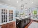 Beautiful kitchen with a large island, custom cabinets, stainless steel appliances, hardwood floors, and a walk-in pantry at 7060 Summit Ridge Chase, Cumming, GA 30041