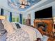 Elegant main bedroom with hardwood floors, a fireplace, and custom furnishings at 7060 Summit Ridge Chase, Cumming, GA 30041