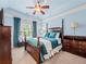 This beautiful bedroom features classic furnishings, including an elegant four-poster bed at 7060 Summit Ridge Chase, Cumming, GA 30041