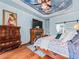 Serene main bedroom featuring hardwood floors, a decorative fireplace, and custom furnishings at 7060 Summit Ridge Chase, Cumming, GA 30041