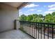 Large balcony with black wrought iron railing and serene treetop views at 840 United Avenue Southeast # 401, Atlanta, GA 30312