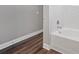 Bright bathroom showcases white tiled walls and a gleaming white bathtub at 840 United Avenue Southeast # 401, Atlanta, GA 30312