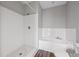 Clean and modern bathroom with tub-shower combo and gray and white tiling at 840 United Avenue Southeast # 401, Atlanta, GA 30312