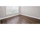 Cozy bedroom with neutral paint, hardwood floors, and a large window at 840 United Avenue Southeast # 401, Atlanta, GA 30312