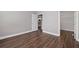 An airy bedroom features beautiful hardwood flooring and a doorway leading to a walk-in closet at 840 United Avenue Southeast # 401, Atlanta, GA 30312