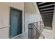 Hallway view of condo unit door with unit number, stairs and railing at 840 United Avenue Southeast # 401, Atlanta, GA 30312
