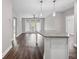 Open-concept kitchen seamlessly flows into the living area, enhanced by a center island and modern lighting at 840 United Avenue Southeast # 401, Atlanta, GA 30312
