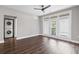 Bright living room featuring modern ceiling fan and access to laundry and outdoor patio at 840 United Avenue Southeast # 401, Atlanta, GA 30312