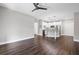 Open concept living space and kitchen with stainless steel appliances and wood floors at 840 United Avenue Southeast # 401, Atlanta, GA 30312